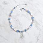 Children’s Disney Cinderella necklace featuring clear glass slipper charm with powder blue beads and white pearl details - princess dress up accessory for girls