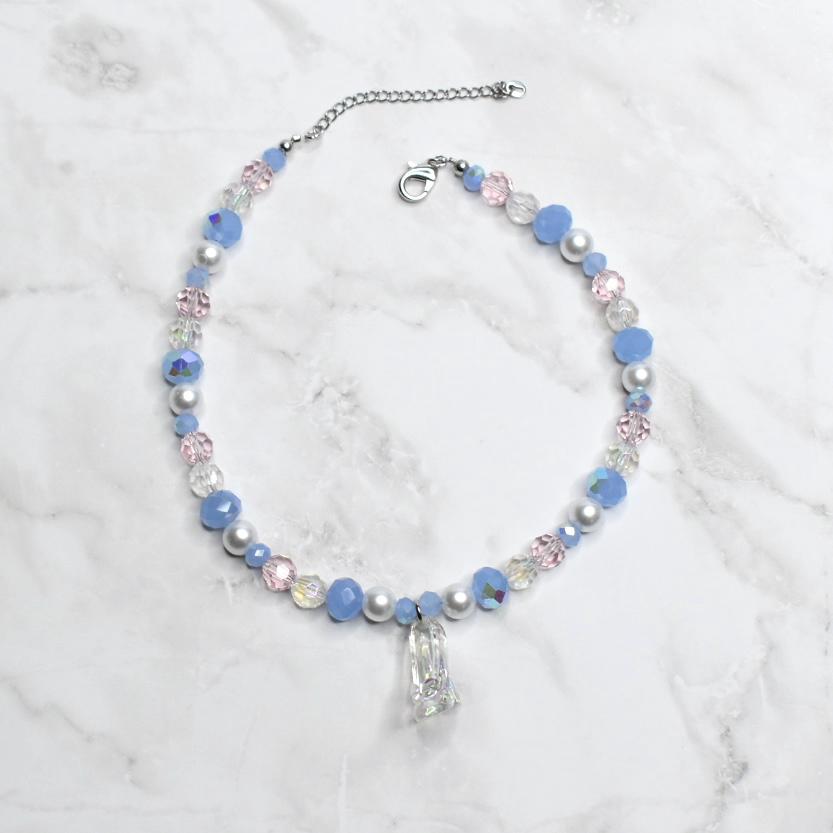 Children’s Disney Cinderella necklace featuring clear glass slipper charm with powder blue beads and white pearl details - princess dress up accessory for girls