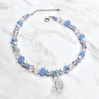 Cinderella inspired necklace for kids with glass slipper pendant, blue beads, silver pearls, and crystal accents on marble background - Disney princess costume jewelry
