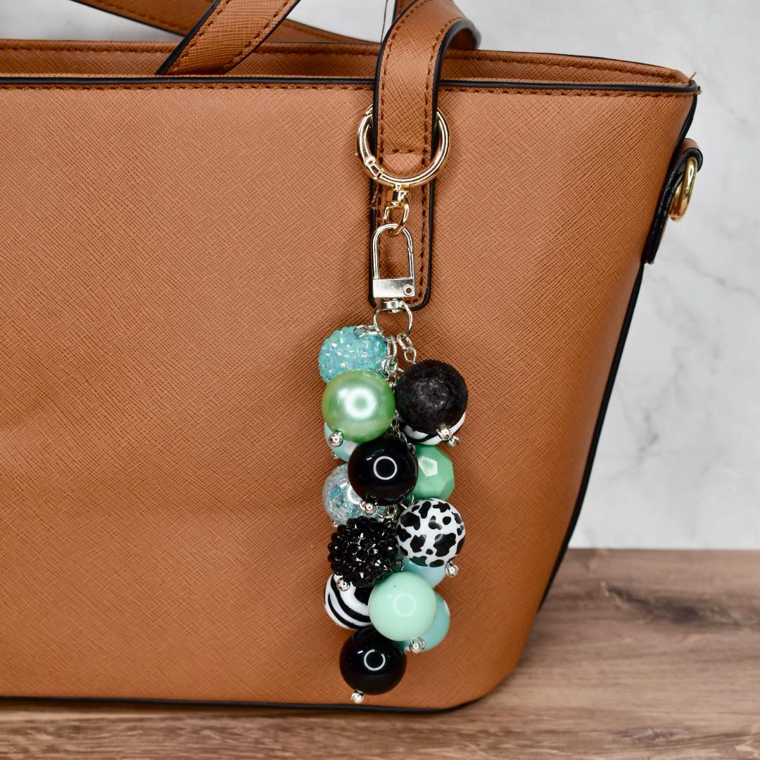 Artisan bag charm keychain with layered chunky beads in mint green black white cow print zebra stripes
