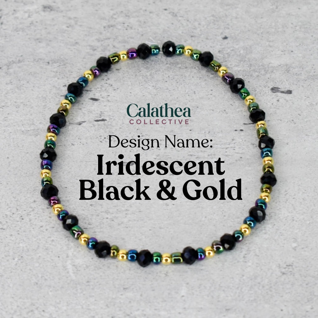 A beaded bracelet with black, iridescent, and gold beads. The bracelet is labeled "Iridescent Black & Gold" and is from the "Calathea Collective" design. The beads are strung together to form a circular shape.