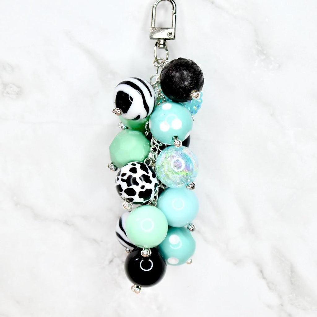 Boho beaded purse charm in turquoise mint black and white with swivel lobster clasp hook flat lay