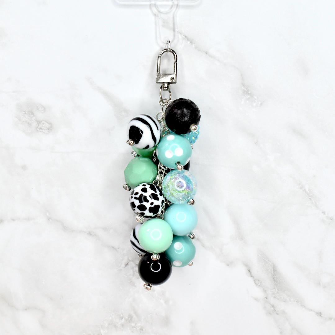 Handmade keychain accessory with chunky pastel mint aqua and monochrome beads featuring zebra stripe and dalmatian spots