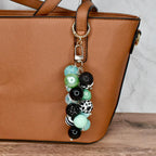 Custom beaded purse charm featuring mint pastel and monochrome beads on lobster clasp hook