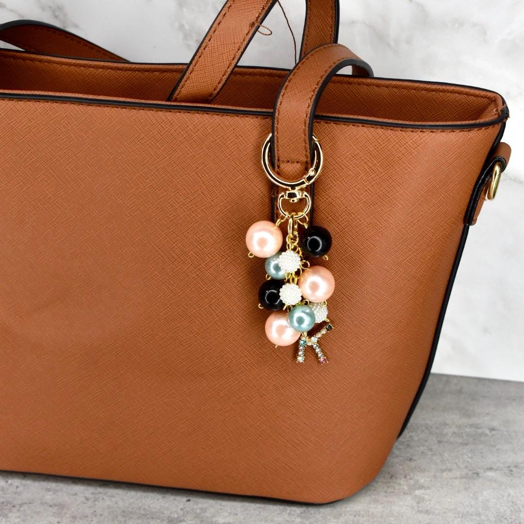 Light pink light blue black and gold beaded handbag charm with rhinestone letter K on gold keyring perfect accessory for brown textured purse with black trim and gold hardware