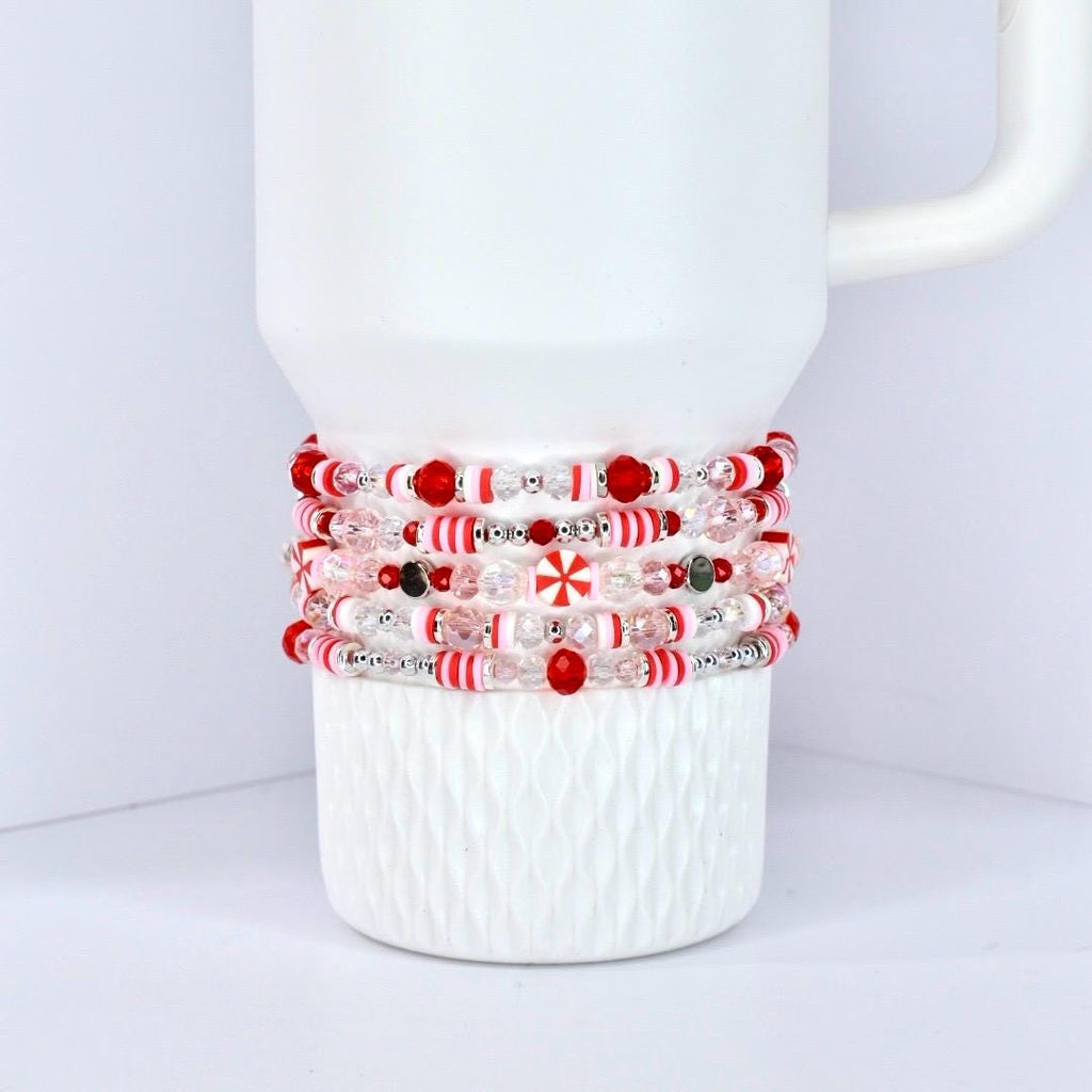 Stanley Tumbler Charm Accessory Holiday Bracelet Collection Candy Inspired Design Strawberry Twist Pattern Elastic Stretch Beaded Style Red Pink White Color Scheme Peppermint Christmas Theme Festive Wrist Wear Individual Pieces Mix Match
