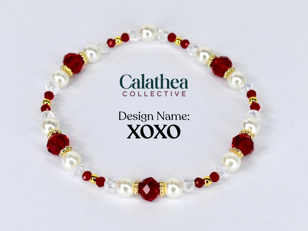 A beaded bracelet featuring alternating white faux pearls, faceted red beads, and small gold-colored beads. The bracelet is labeled "Design Name: XOXO" and includes the "Calathea Collective" logo.