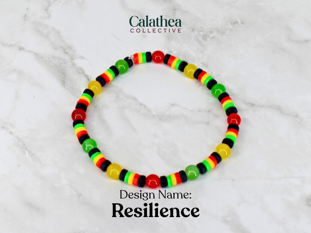 A beaded bracelet with red, yellow, green, and black beads. The bracelet is labeled "Resilience" and is from the Calathea Collective. The beads are arranged in a pattern of alternating colors.