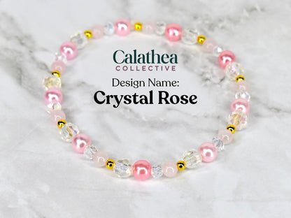 A beaded bracelet with pink, clear, and gold-colored beads. The bracelet features the text "Calathea Collective" and "Design Name: Crystal Rose". The beads are arranged in a circular pattern.