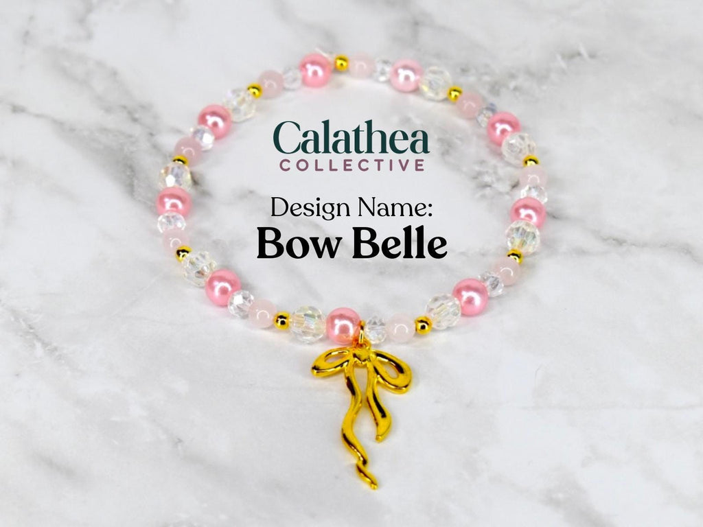 A beaded bracelet with pink, clear, and gold beads. The bracelet has a gold bow charm. The text on the image reads "Calathea Collective" and "Design Name: Bow Belle."