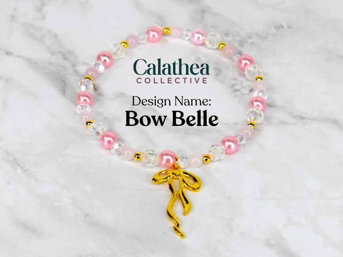 A beaded bracelet with pink, clear, and gold beads. The bracelet has a gold bow charm. The text on the image reads "Calathea Collective" and "Design Name: Bow Belle."