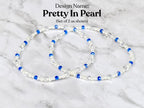 Two bracelets with the design name "Pretty In Pearl". Each bracelet features white pearls, clear crystals, and blue beads. The bracelets are displayed on a white and gray marble surface.
