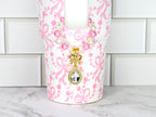 Elegant gold bow charm with teardrop crystal centerpiece on pearl and bead bracelet feminine jewelry accessory
