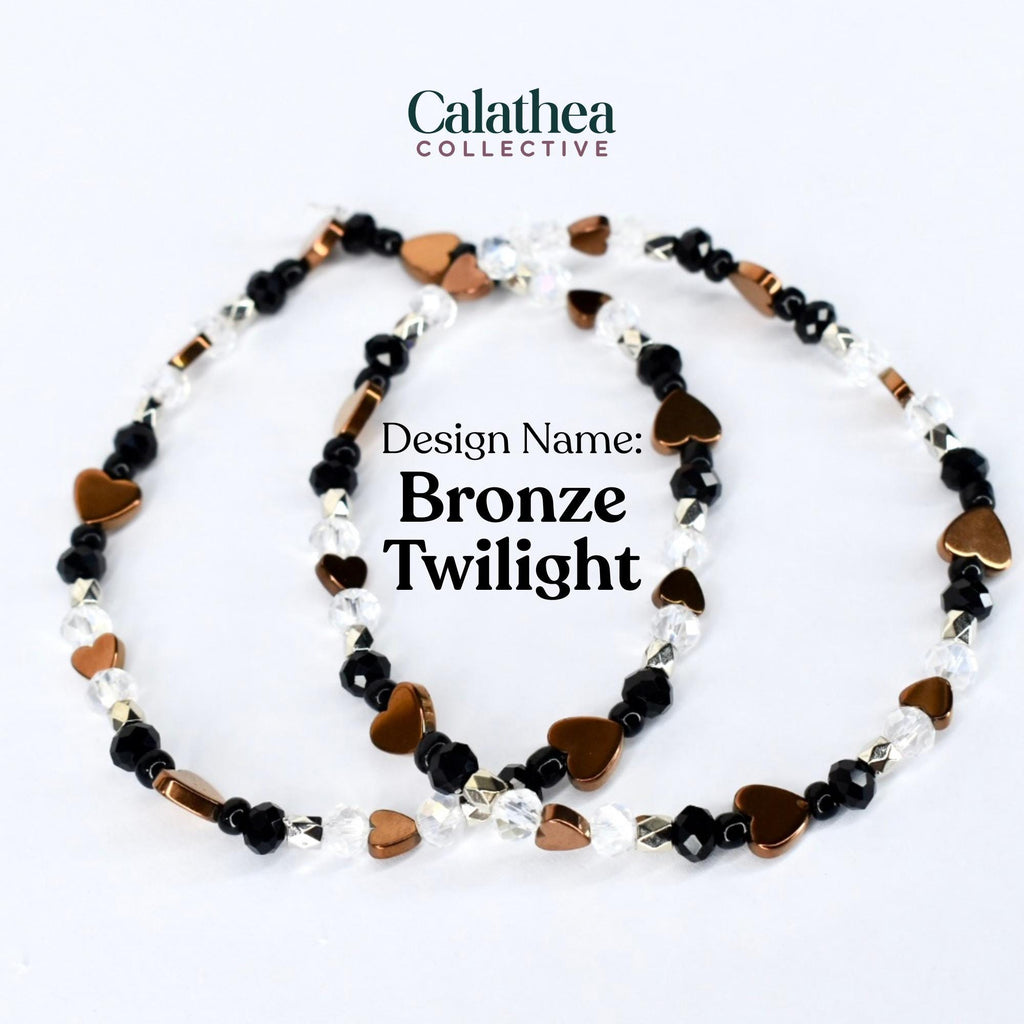 Two beaded bracelets with the text "Design Name: Bronze Twilight". The bracelets feature bronze heart-shaped beads, black beads, and clear crystal beads. The bracelets are from the Calathea Collective.