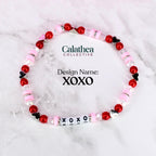 A single bracelet with red and pink beads and letter beads spelling XOXO in the bottom center of the image. The center of the photo shows the design name 'XOXO.'