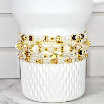 Starlight Shimmer Bracelet Collection Celestial Wrist Accessory Set Crystal Design Elegant Gift Luxe Birthday Present Five Piece Bracelet Set Pearl Gold Accents Dainty Layered Look Everyday Elegance Special Occasion Sparkle Magical