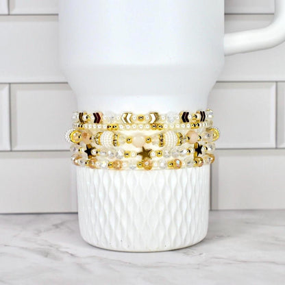 Shimmer Bracelet Set Starlight Collection Celestial Design Crystal Wrist Accessory Glass Pearl Combination Gold Accent Details Five Piece Bracelet Set Dainty Layered Look Magical Sparkle Effect Elegant Birthday Gift Luxe Present Idea