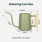 Sage green watering can with a wooden handle. The can is 10.2 inches long, 7 inches high, and 4.2 inches wide. The handle is 5.4 inches high and 4.4 inches wide. Holds 35oz of water. Text: Watering Can Size.
