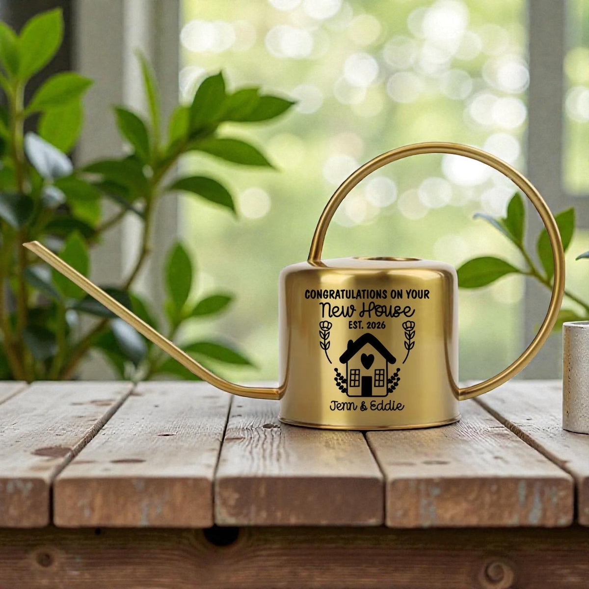 Gold Watering Can Personalized Housewarming Gift Custom Plant Tool New Home Present Special Occasion Celebration Memorable Keepsake Stainless Steel Design Customizable Names Year House Illustration Elegant Long Spout Indoor Garden Accessory
