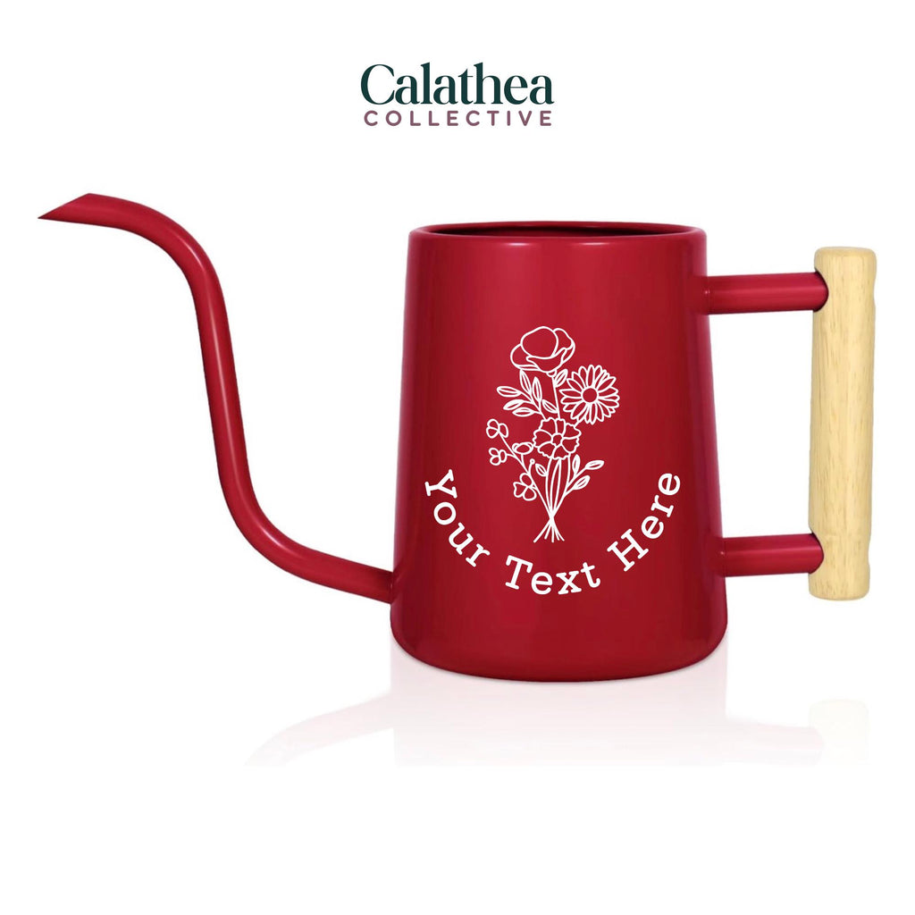 A red watering can with long gooseneck spout and wood handle with a white flower bouquet design and 'your text here' below the bouquet in white permanent vinyl.