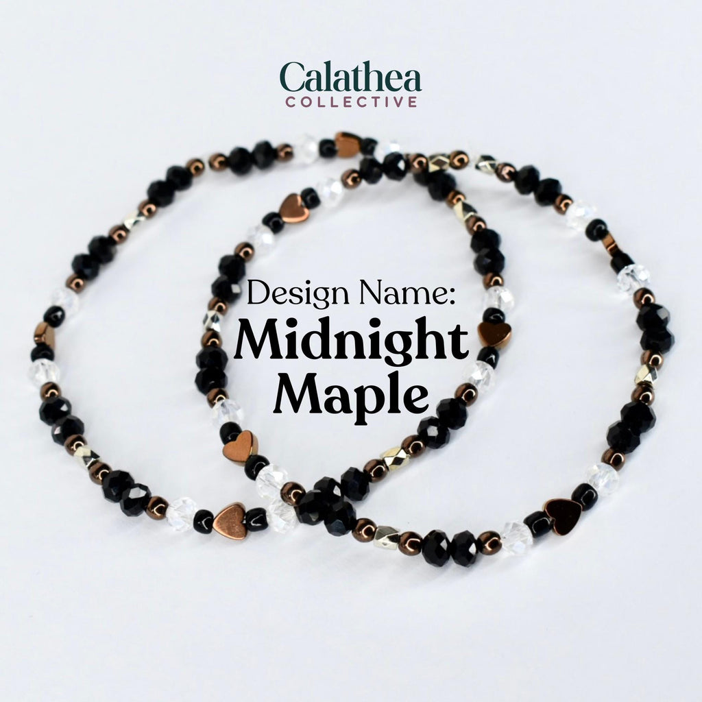 Two beaded bracelets with the text "Design Name: Midnight Maple". The bracelets feature black, clear, and copper-colored beads, including heart-shaped accents. The bracelets are on a white background.
