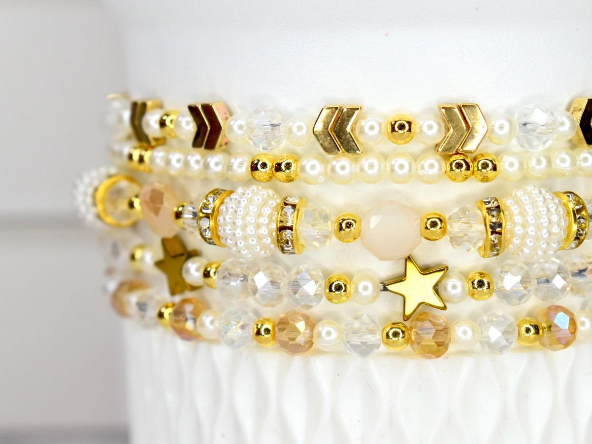 Layered Bracelet Set Starlight Shimmer Collection Celestial Design Concept Five Piece Wrist Accessory Crystal Pearl Elements Gold Accent Details Dainty Stackable Option Versatile Styling Choice Elegant Gift Idea Luxe Birthday Present