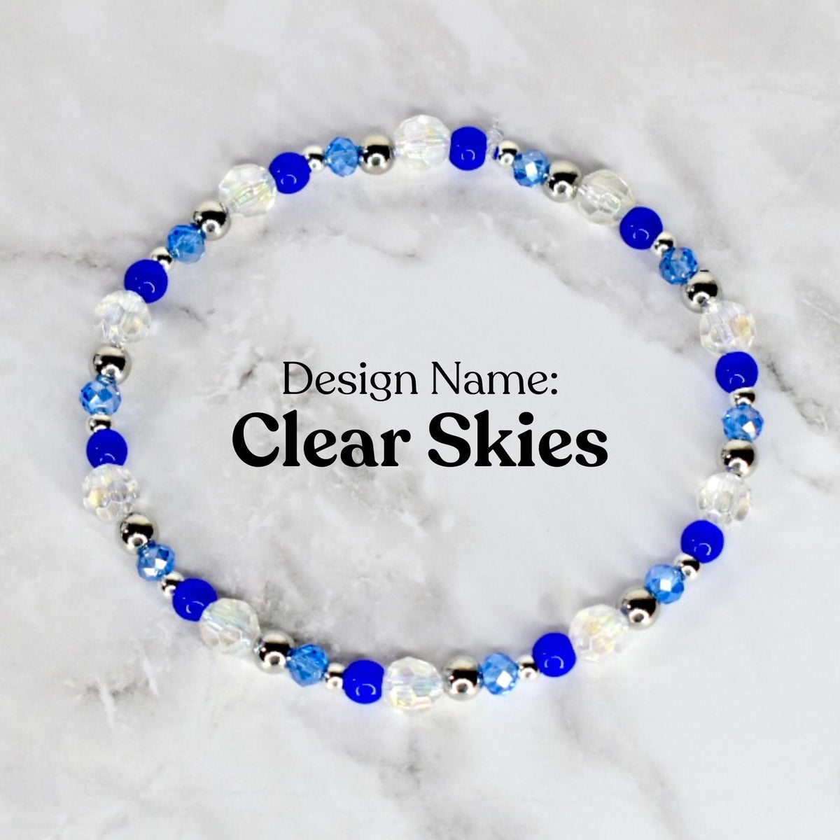 A beaded bracelet with the design name "Clear Skies." The bracelet features a circular arrangement of clear, blue, and silver beads. The beads are a mix of faceted and round shapes, creating a sparkling effect. The text "Design Name: Clear Skies" is displayed.