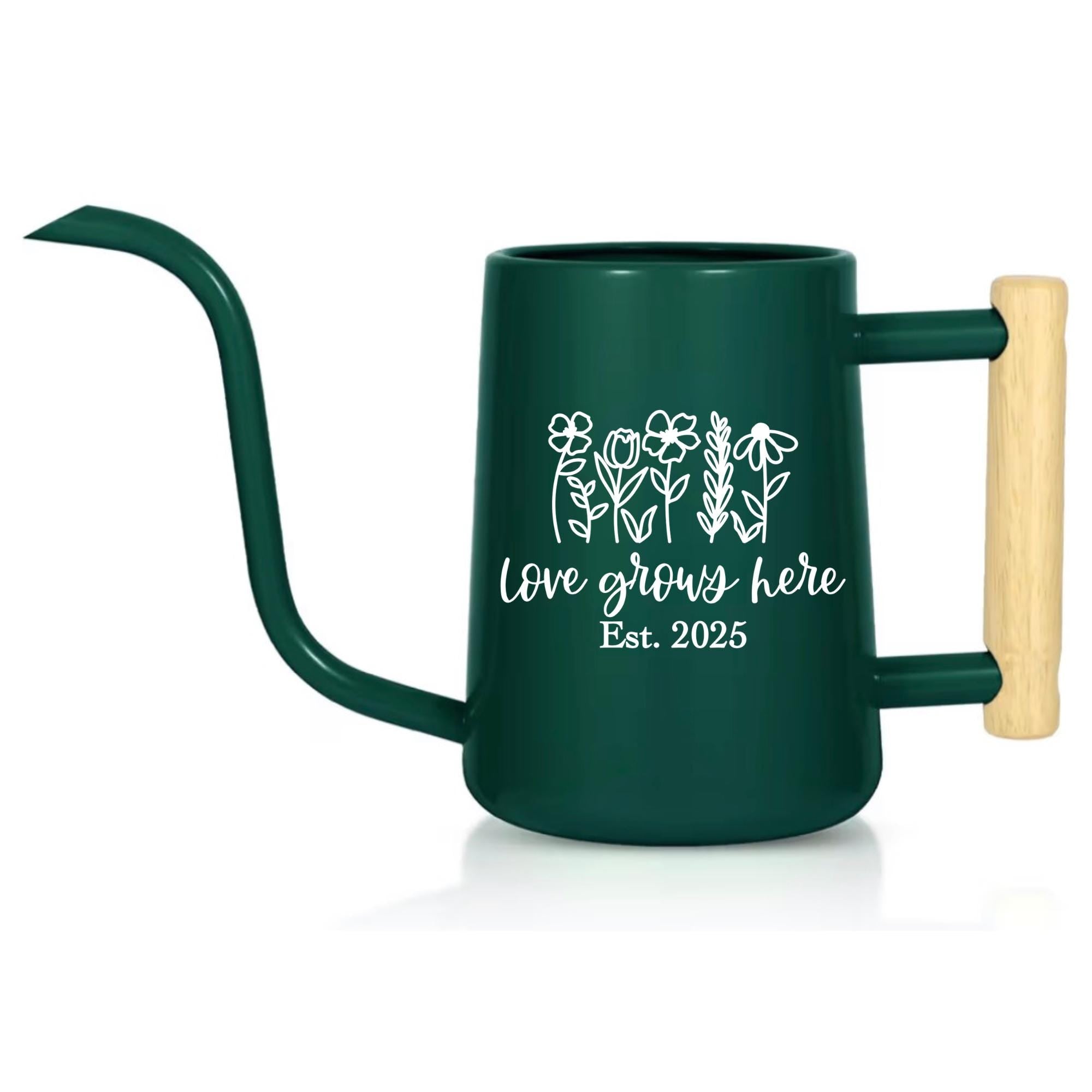 A dark green metal watering can with a long, curved spout and a wooden handle. The can features white floral line art and the text "love grows here Est. 2025". Ideal for gardening and plant care.