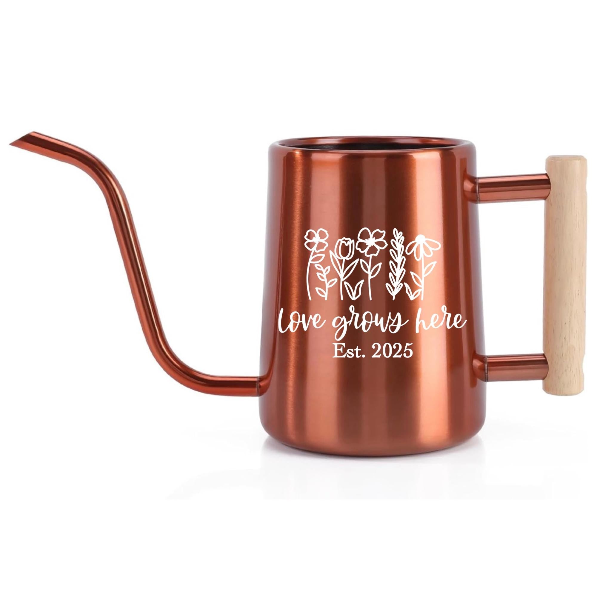 Copper-colored watering can with a long spout and wooden handle. The can features a white floral design and the text "Love grows here Est. 2025". Ideal for indoor or outdoor gardening, this watering can is a stylish addition.
