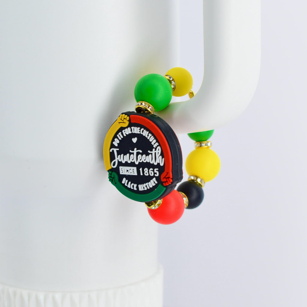 A beaded bracelet with a Juneteenth theme. The bracelet features a black, red, yellow, and green color scheme. The central charm reads "Do it for the culture" and "Juneteenth Since 1865 Black History".