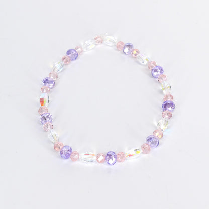 A delicate bracelet featuring a mix of clear, iridescent, and pastel-colored beads. The design incorporates oval and round beads in shades of pink and purple, creating a subtle, feminine accessory.