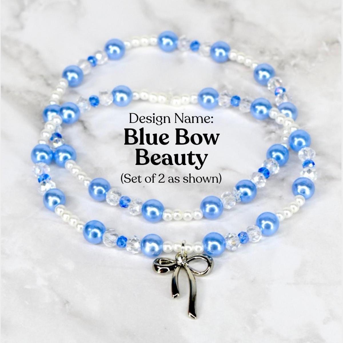 Two beaded bracelets with blue and white beads, and a silver bow charm. The necklaces are labeled "Blue Bow Beauty" and are displayed on a marble surface. The beads are a mix of round and crystal-like shapes.