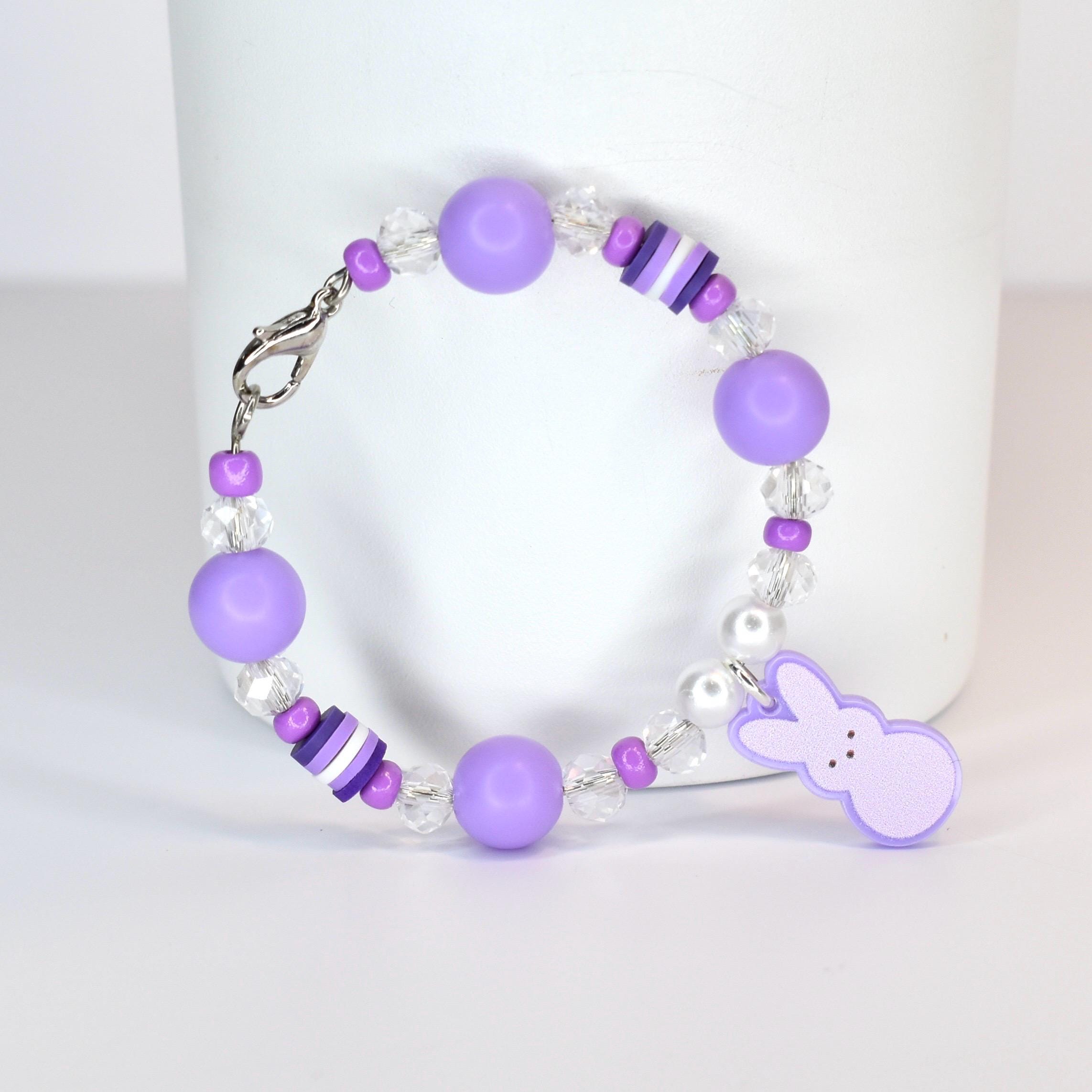 Purple PEEPS tumbler handle charm with pastel purple, gradient purple, crystal and pearl accent beads. A pastel purple PEEPS charm is the focal point of the bracelet.