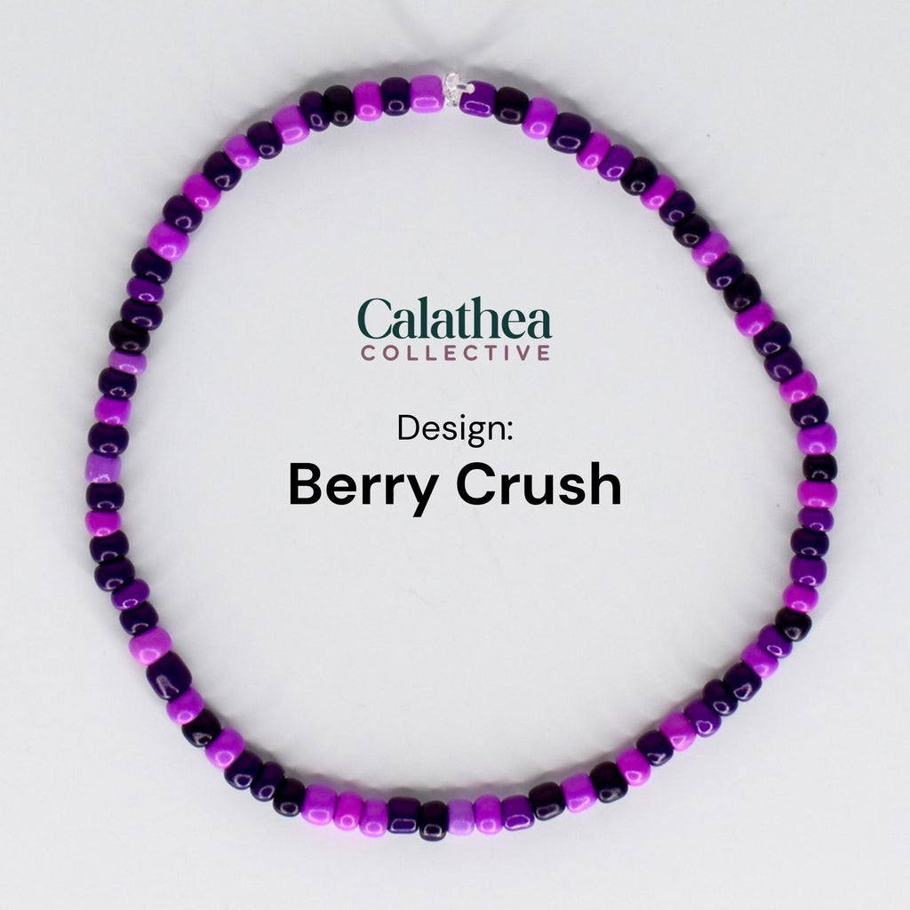 A beaded bracelet in a circular shape, featuring a mix of purple and dark purple beads. The text "Calathea Collective" and "Berry Crush" are displayed on the image.
