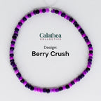 A beaded bracelet in a circular shape, featuring a mix of purple and dark purple beads. The text "Calathea Collective" and "Berry Crush" are displayed on the image.