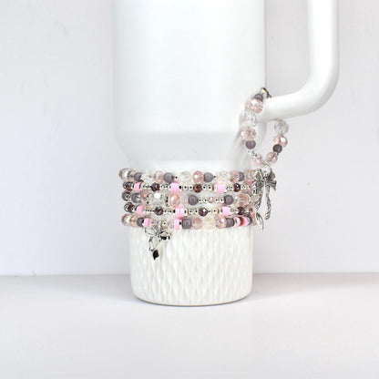 A set of three ceramic mugs with a speckled, matte finish. The mugs are in shades of cream, light brown, and dark brown. Each mug has a simple, minimalist design, perfect for coffee or tea.