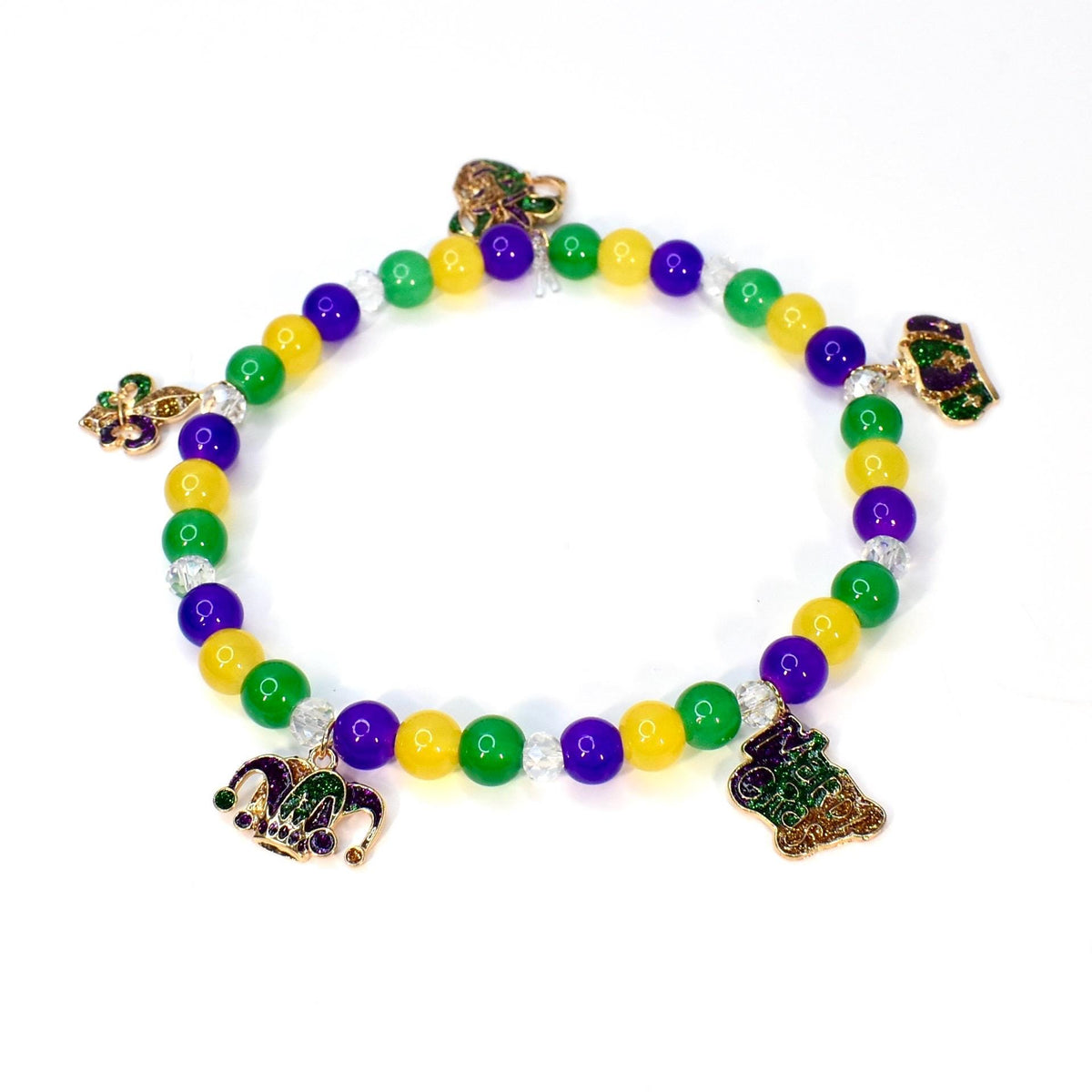 A beaded bracelet featuring green, yellow, and purple beads, with decorative charms. The charms include a fleur-de-lis, a jester's hat, and a decorative emblem. The bracelet is designed with a stretchable band, suitable for various wrist sizes.