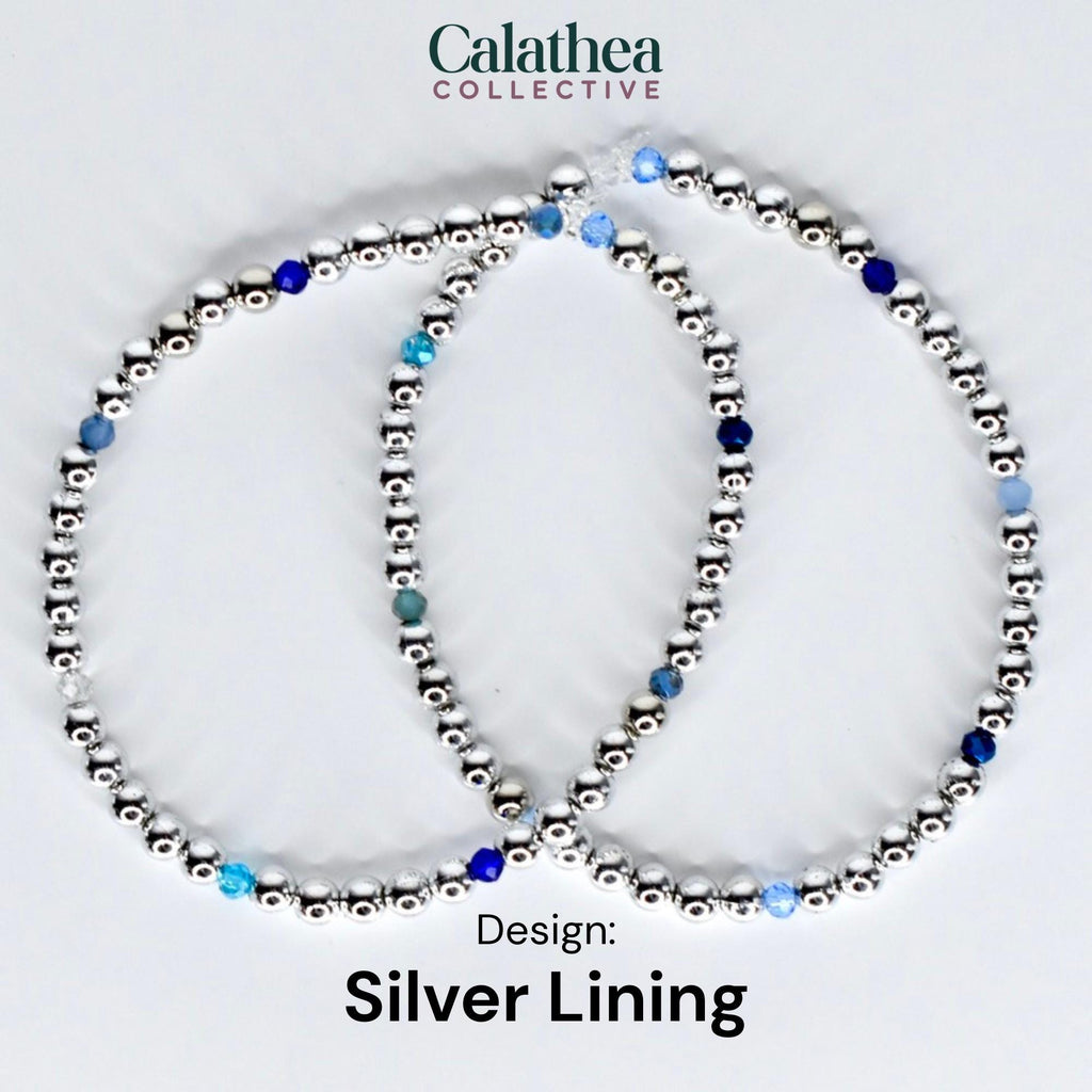 Two silver beaded bracelets with blue and clear accent beads. The bracelets are arranged in a circular shape. The text "Calathea Collective" is at the top, and "Design: Silver Lining" is at the bottom.