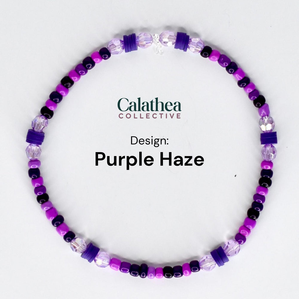 A beaded bracelet in shades of purple, black, and clear. The bracelet features a variety of bead shapes and sizes, including small round beads and larger square beads. The text "Calathea Collective" and "Design: Purple Haze" are visible.