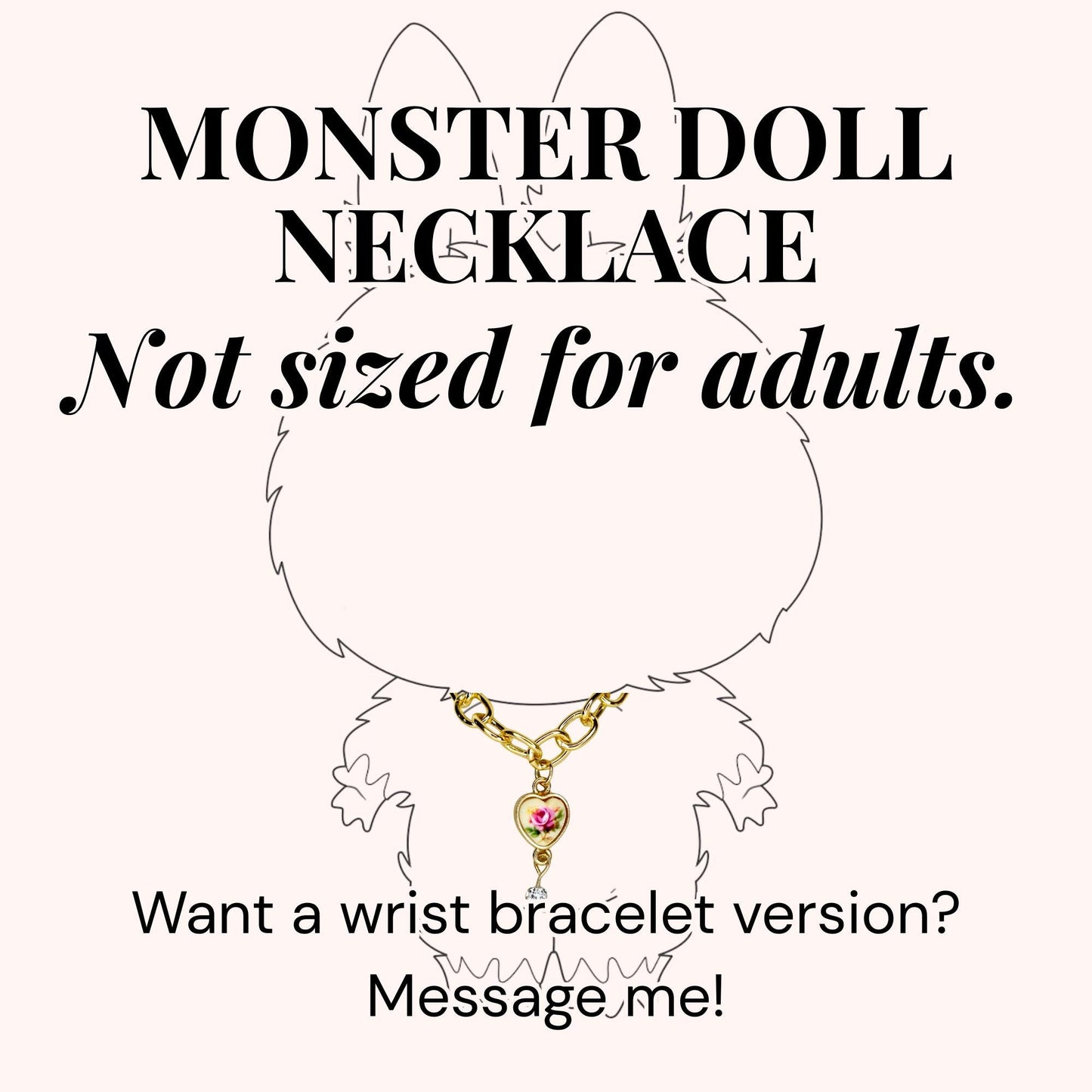 A gold-colored necklace with a heart-shaped pendant featuring a pink rose design. The image includes the text "MONSTER DOLL NECKLACE" and "Not sized for adults." The text "Want a wrist bracelet version? Message me!" is also present.
