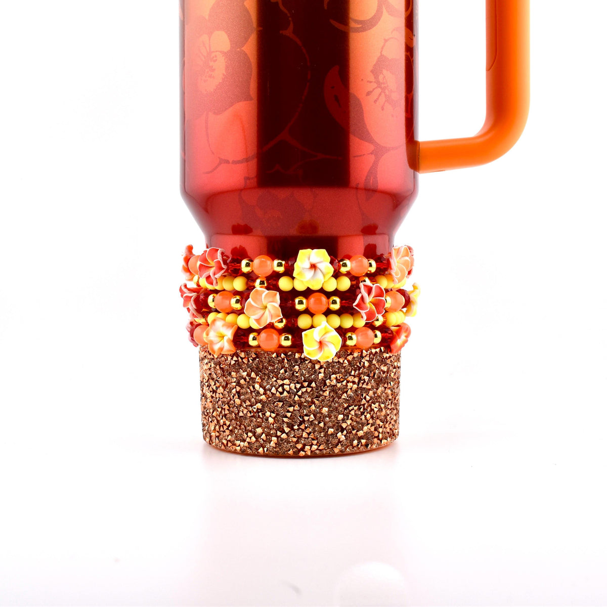 A Karol g Stanley with a matching set of five beaded bracelets.