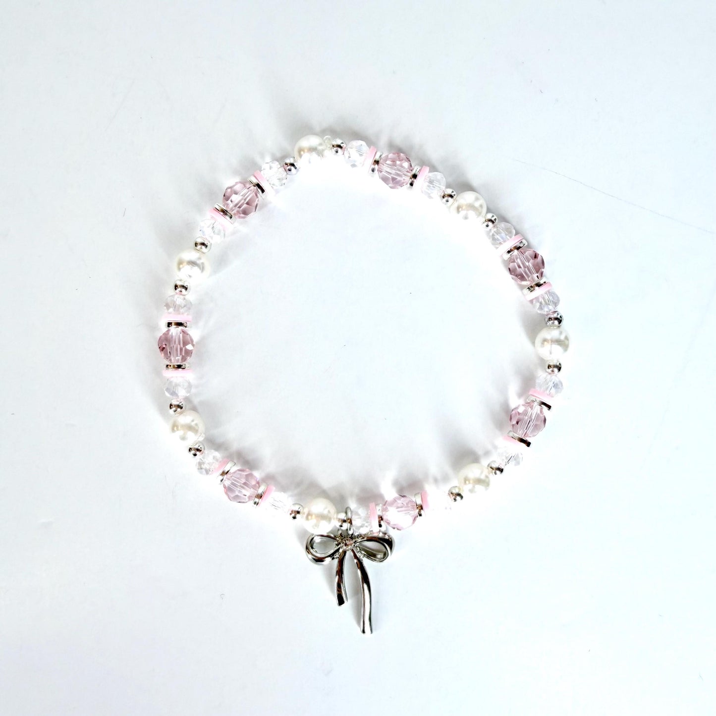 Pink and Silver Bracelet Collection with Silver Bow Charm