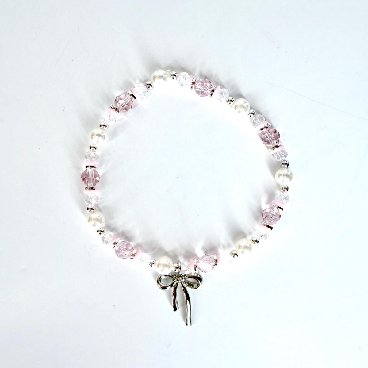 Pink and Silver Bracelet Collection with Silver Bow Charm