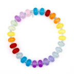 A colorful bracelet featuring a rainbow of glass beads. The beads are oval-shaped and strung together with a silver-colored string. The bracelet showcases a vibrant spectrum of colors, including red, orange, yellow, green, blue, and purple.