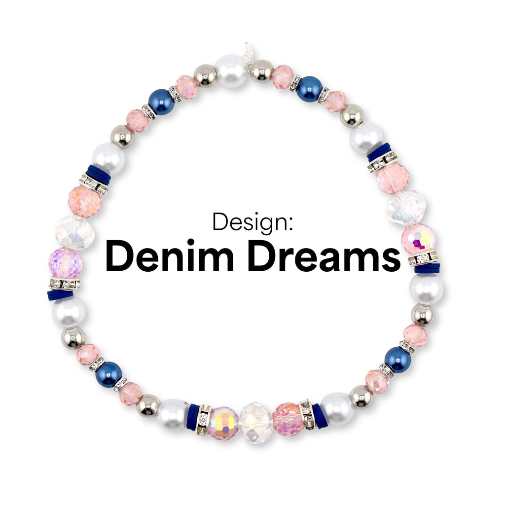 A beaded bracelet with the text "Denim Dreams." The bracelet features a mix of white, pink, blue, and iridescent beads. Silver-colored beads and dark blue accents are also present in the design.