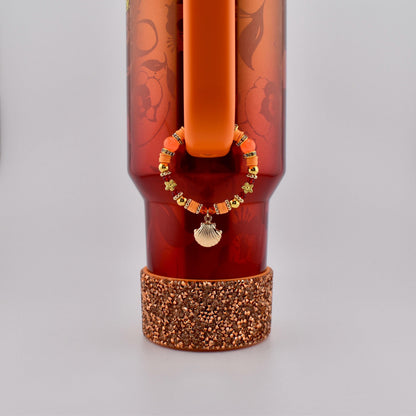 Orange Red and Gold Tumbler Handle Charm Bracelet with Shell Charm