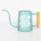 Personalized mint green watering can with wooden handle, customized with 'Thank You for Helping Me Grow' and name Olivia in white floral design — teacher appreciation gift, plant lover gift, custom gardening gift