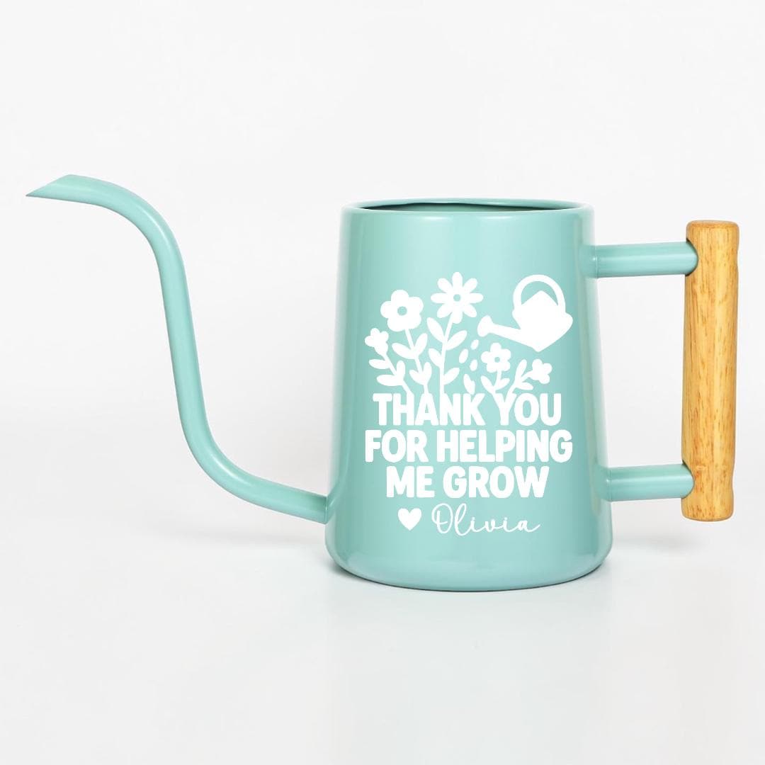 Personalized mint green watering can with wooden handle, customized with 'Thank You for Helping Me Grow' and name Olivia in white floral design — teacher appreciation gift, plant lover gift, custom gardening gift
