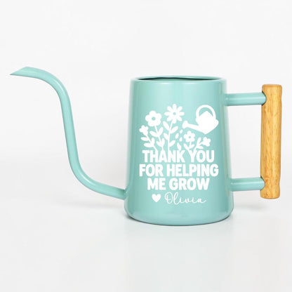 Personalized mint green watering can with wooden handle, customized with 'Thank You for Helping Me Grow' and name Olivia in white floral design — teacher appreciation gift, plant lover gift, custom gardening gift