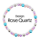 A beaded bracelet with the text "Design: Rose Quartz". The bracelet features a variety of beads in shades of pink, purple, and turquoise, interspersed with silver-colored beads. The beads are arranged in a circular pattern.